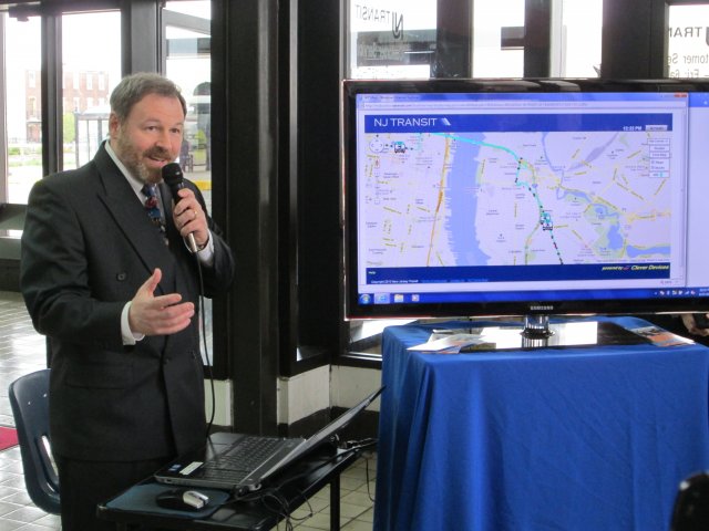 image of Jim with bus tracker screen